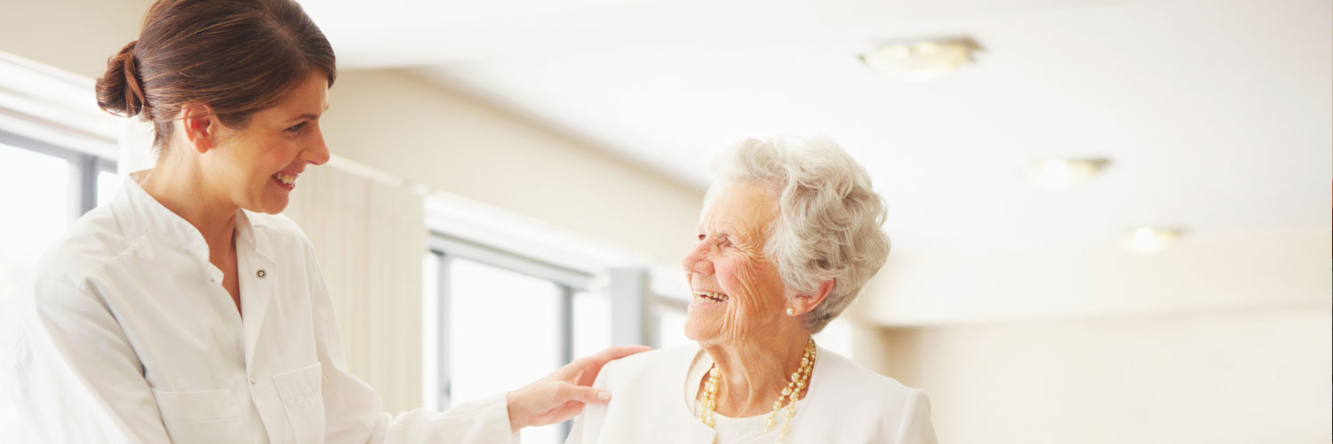 caregiver and elderly woman talking